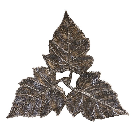 Trivet in three leaf design. Dark nickel finish.
