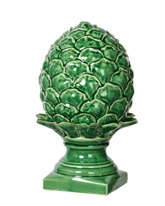 Ceramic green coloured ornament in shape of an artichoke on a stand.