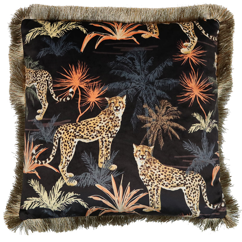 Black velvet square cushion with patterns of cheetahs and grasses, with fringed edging.