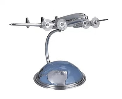 Silver coloured model of Constellation aircraft, mounted above sea and land podium stand.
