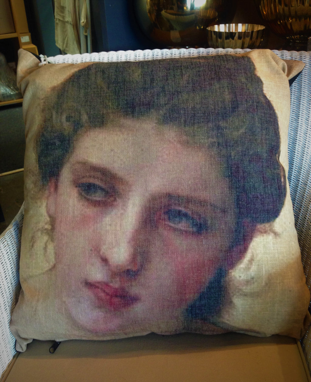Large square cushion in linen with female face print.