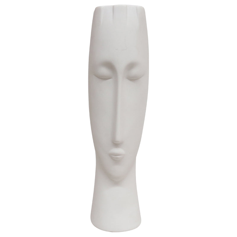 White coloured ceramic vase in face design.