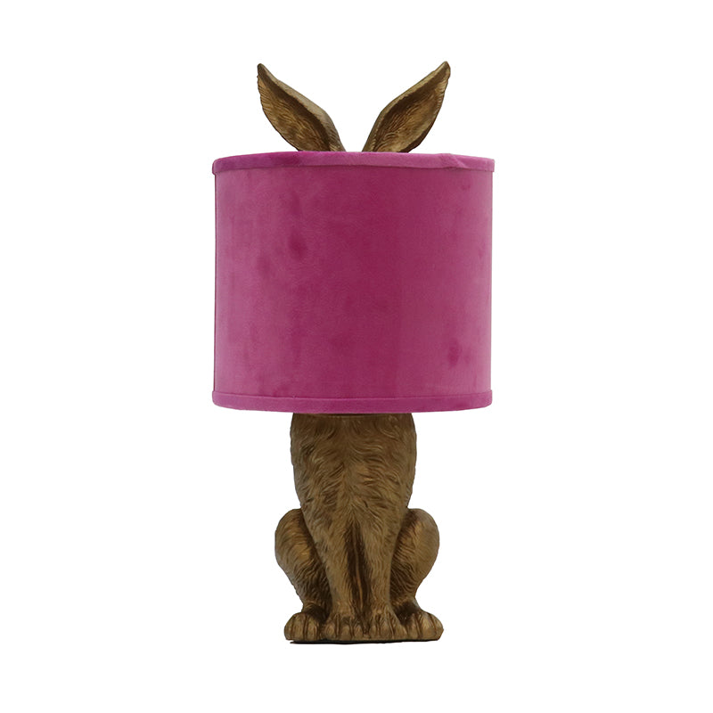 Rabbit shaped lamp with pink coloured fabric shade.