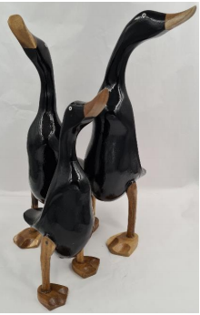 Three large duck ornaments in black colour with bronze coloured bills and feet.