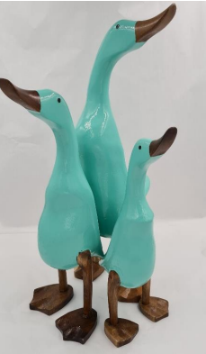 Three duck ornaments in teal colour with bronze colour bills and feet.