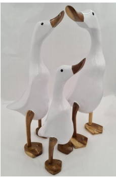 Three duck ornaments of different sizes in white colour.