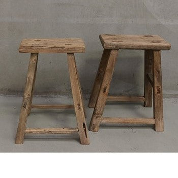 Elm stools with four legs. Knots and uneven edges. No two are the same.