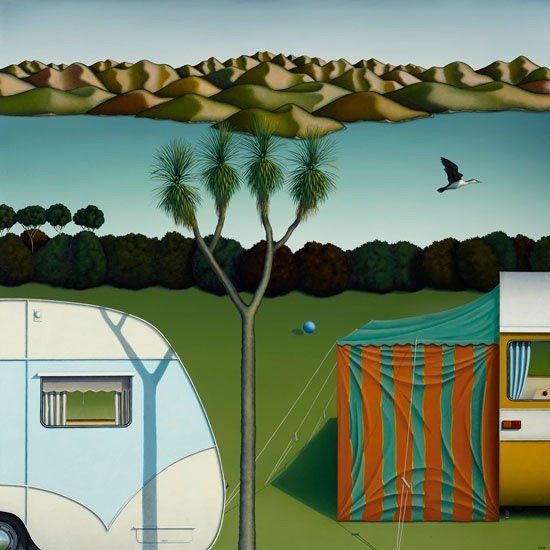 Countryside scene with hills in the background and lake. Two caravans in the foreground one with an awning.