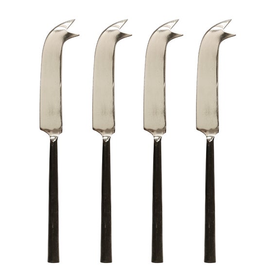 Four stainless steel cheese knives.