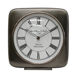 Square clock in satin grey colour with white face and Roman Numerals.